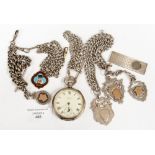 A silver Waltham open faces Hunter with assorted silver watch chains and silver cigar cutter,