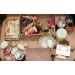 A box of collectables including celluloid dolls, onyx and marble eggs, pewter,