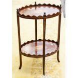 An Edwardian mahogany inlaid two-tier occasional table