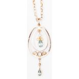 An Edwardian 9ct openwork pendant set with aquamarine and a seed pearl