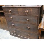 An early 20th Century oak chest of drawers fitted with two short over three long graduated drawers.