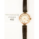 A circa 1920s 9ct gold ladies Rolex with strap