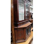 An oak glazed TV stand, a quarter veneered beech coffee table, raised on turned legs,