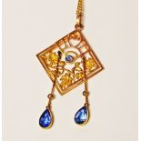 An Edwardian 9ct stylised pendant set sapphires