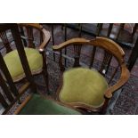 A pair of Edwardian mahogany corner chairs with inlaid crest rails, pierced back splats,