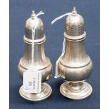 A pair of Rogers sterling silver baluster pepper pots (2)
