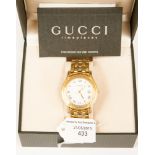 A Gucci gentlemen's wristwatch with white dial, Roman numerals and date aperture,