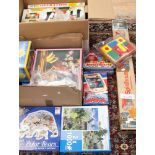 A boxed Wendy House and two boxes containing puzzles, jigsaws, badges, figures,