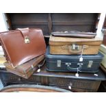 Two early 20th century brown leather suitcases,