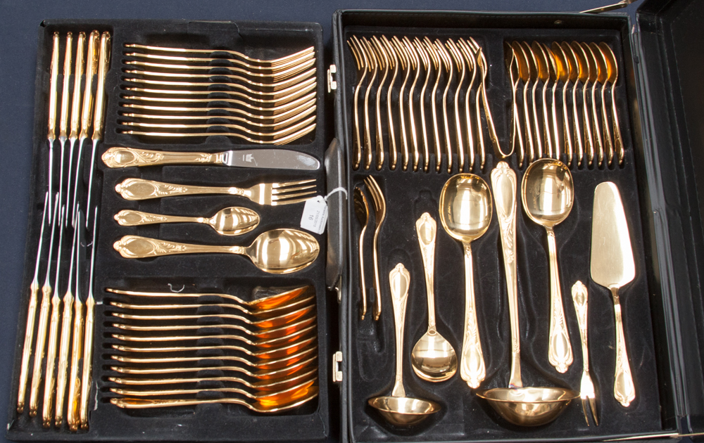 A German Solingen cased 12 place canteen of cutlery, in 24 carat gold plate,