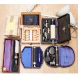 A large collection of vintage optical equipment to include lenses, spectacles, ophthalmoscopes,