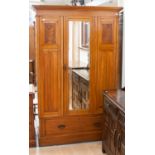 A late Victorian satin Birch single door wardrobe,