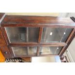 An early 20th Century glazed two door and two drawer bookcase.