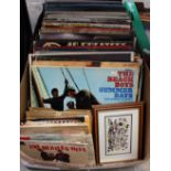 A collection of LPs + 7 inch records, including Bob Dylan, The Beatles, Elvis Presley,