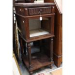 A small 20th Century bedside cabinet with a granite top fitted with single door.