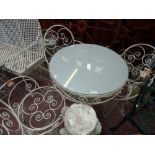 A white painted aluminum garden bistro set,