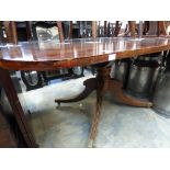 An early Victorian mahogany tilt top breakfast table, raised on a heavy turned column,