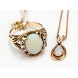 A 14k opal and diamond ring and pendant (2)