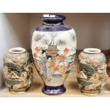 A pair of Satsuma vases, early 20th Century, Meiji period and a single taller Satsuma vase,