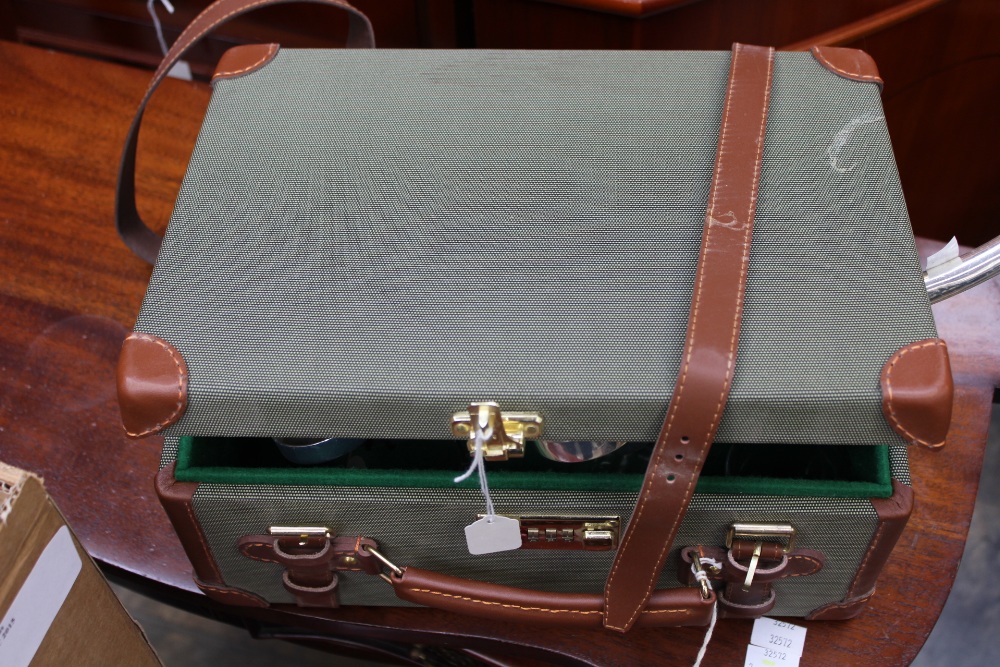 A baize lined shotgun cartridge case of suitcase form,