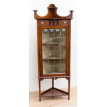 An Edwardian mahogany and satinwood inlaid lead glazed display corner cabinet