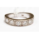 A 9ct  white gold diamond half hoop eternity ring,