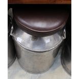 **TO BE SOLD BT PRIVATE TREATY**
A pair of leather upholstered steel milk churns,