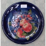 A Moorcroft finches and berries plate,