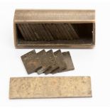 An early 20th Century miniature brass cased set of domino,