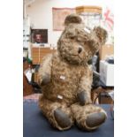 A large straw filled teddy bear,