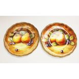 A pair of Coalport fruit painted cabinet plates signed N.