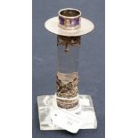 A white metal, purple enamel and glass candlestick,