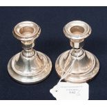 A pair of George V silver dwarf candlesticks,