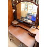 An Edwardian mahogany dressing chest.