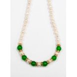 A Freshwater Pearl and Jade single strand necklace,