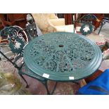 A Victorian style green painted aluminum garden bistro set,