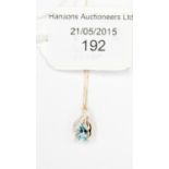 A topaz and diamond pendant on 9ct chain