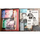 A collection of Elvis Presley memorabilia comprising records, programmes, film magazines,