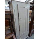 A late 19th Century white painted single door wardrobe fitted with a single drawer.