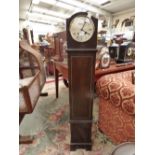 A granddaughter clock, Roman numerials on silvered dial,