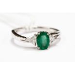 An 18ct emerald and diamond ring