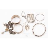 Two silver napkin rings; two silver bangles; fob; crucifix; white metal vesta etc, 1.