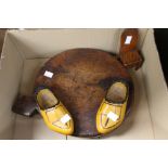 A naive and rustic chopping board, perhaps 19th century, together with two wooden painted clogs,