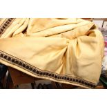 Two large gold coloured curtains,