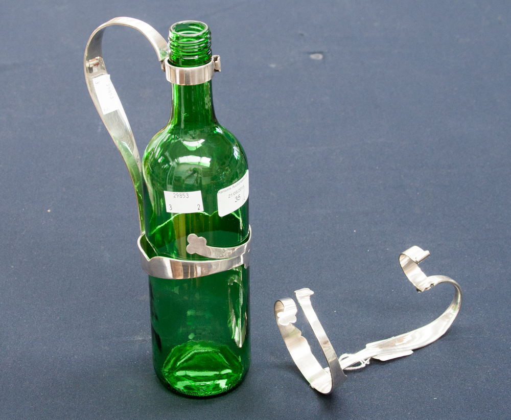 Two silver plated wine bottle handle/pourers