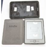 A Samsung tablet, plus a Kindle,