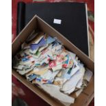 Freelance stamp album with contents and a shoebox containing loose stamps