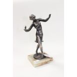 A cast silvered metal figure of a young lady dancing with a pigeon on her hand, 1920s style,