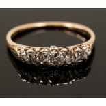 An Edwardian five stone ring set with brilliant cut diamonds weighing approximately 0.