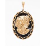 **VENDOR COLLECTED 7/7/15  JMS *** An onyx, gold and diamond oval pendant,